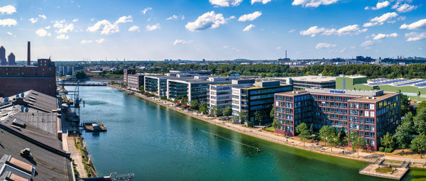 High angle view of buildings in city against sky