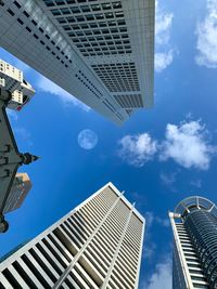 Low angle view of modern buildings against sky