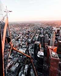 High angle view of buildings in city against sky during sunset