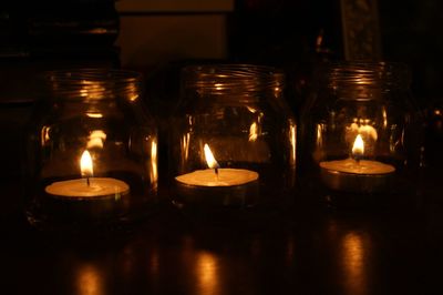 Close-up of lit tea light candles