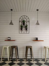 Empty chairs and table in house