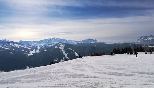 View of snow covered mountain against cloudy sky