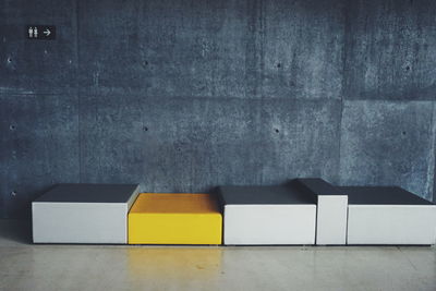 Modern chairs against wall at harpa