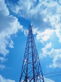 Low angle view of electricity pylon against sky