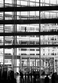 People walking in modern building in city