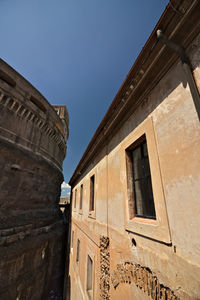 Low angle view of old building against clear sky