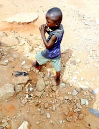 Young boy busy day playing alone.