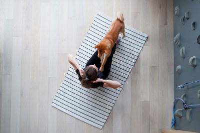 High angle view of woman relaxing on floor