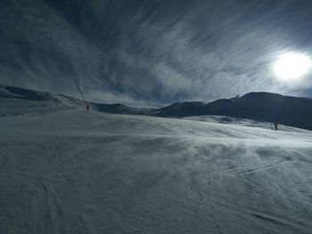 Scenic view of landscape against sky during winter