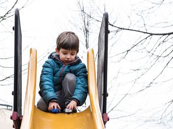 Portrait of cute boy in playground