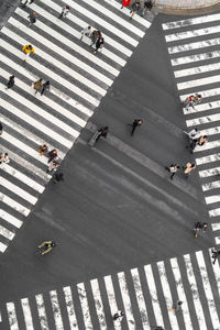 High angle view of people crossing road