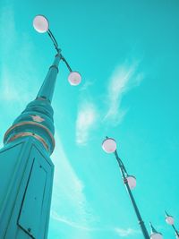 Low angle view of street light against sky