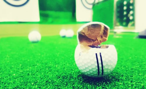 Close-up of soccer ball on grass