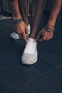 Low section of man standing on floor