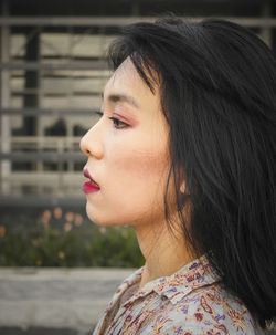 Close-up portrait of woman looking away