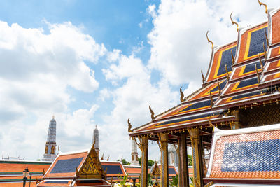 Low angle view of temple building against cloudy sky