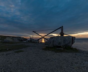 View of beach against sky during sunset