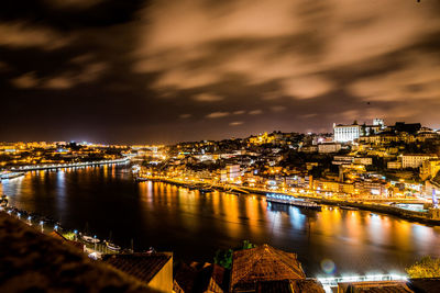 Illuminated city at waterfront