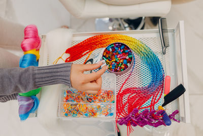 High angle view of hand holding equipment