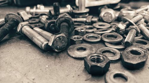 Close-up of nuts and bolts on table