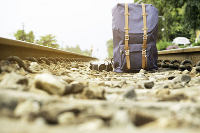 Low section of man standing on railroad track