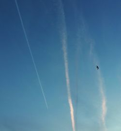 Low angle view of vapor trails in sky