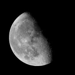 Low angle view of moon against clear sky at night