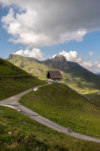 Scenic view of landscape against cloudy sky