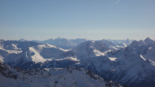 Scenic view of snowcapped mountains against sky