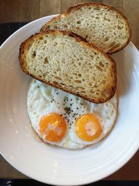 High angle view of bread and omelet served on table