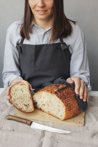 Midsection of woman holding food