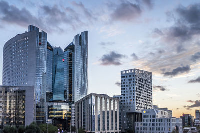 Modern buildings in city against sky