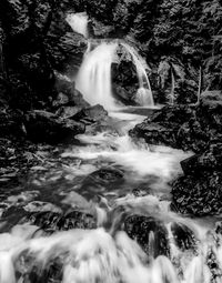 View of waterfall along rocks