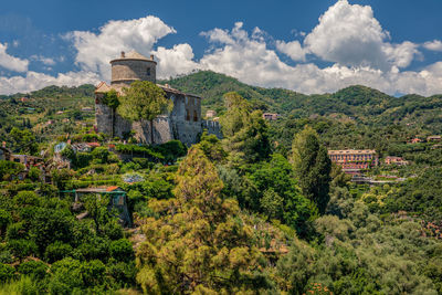 Panoramic view of castello brown and green lushy area of portofino, liguria, italy