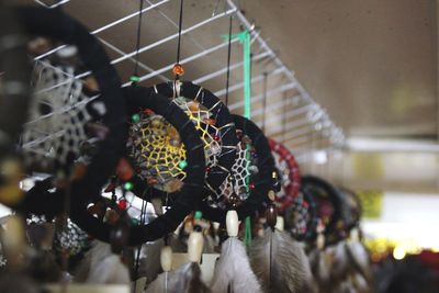 Close-up of dream catchers hanging at market stall