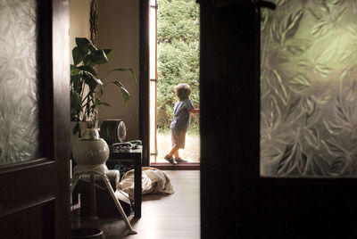 Woman seen through window