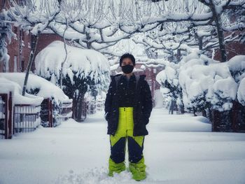 Full length of woman standing in snow