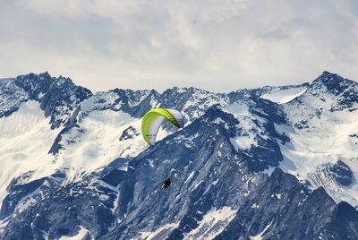 Scenic view of snow covered mountains against sky