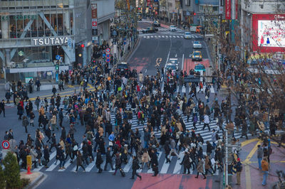 People walking on road in city