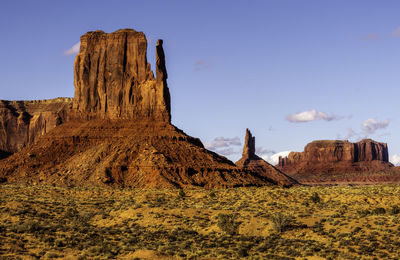 Rock formations in desert against sky