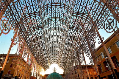 Low angle view of illuminated built structure against sky