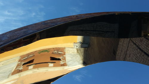 Low angle view of building against blue sky