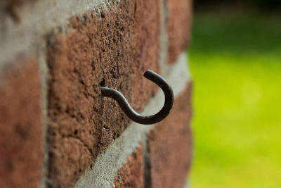Close-up of rusty metal against wall