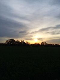 Scenic view of landscape against cloudy sky