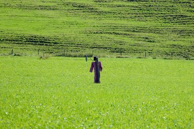 Man standing on grassy field