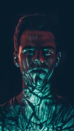 Close-up portrait of a serious young man