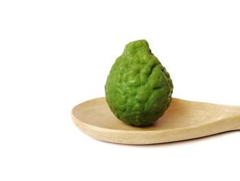 Close-up of fruit against white background