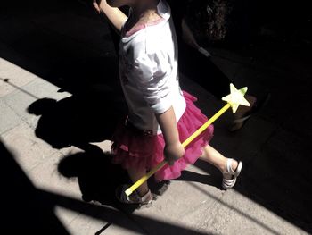 Low section of man with shadow on the floor