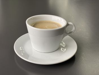 Close-up of coffee cup on table