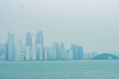 Modern cityscape against sky
